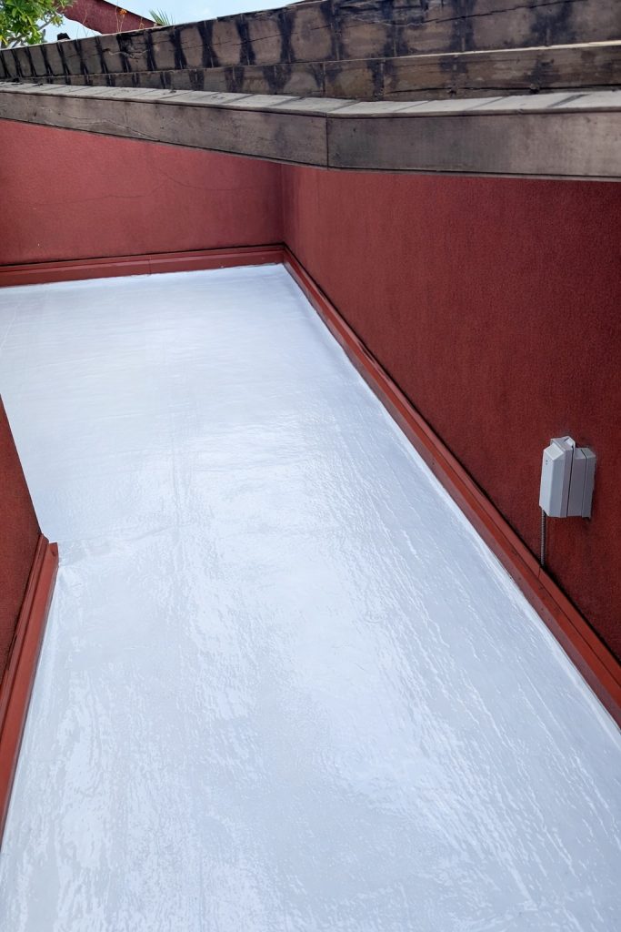 waterproof deck surface with sealed coating applied to prevent water intrusion