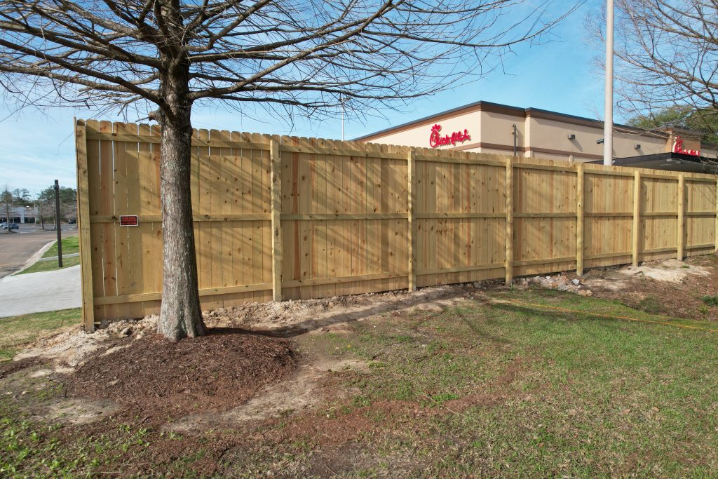 ommercial pine privacy fence installation for Chick-fil-A in Covington Louisiana by GRC Outdoor Living
